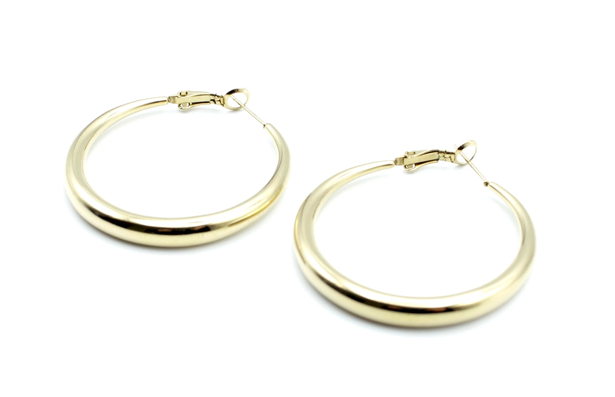 Pendientes Aro Basics acero inoxidable dorado, acabado brillante, diseño sofisticado con atenuación de diámetro en los extremos y cierre catalán. - delacabra