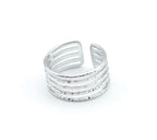 Anillo Burn acero inoxidable plateado, acabado brillante rugoso limado, cinco lineas unidas en los extremos. - delacabra