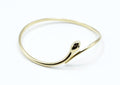 Brazalete Snake acero inoxidable dorado con forma de serpiente,  
dos circonitas, joya fina y elegante- delacabra