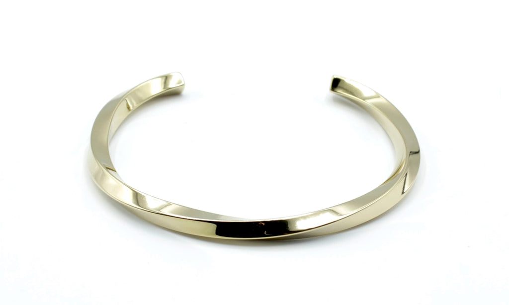Brazalete Sweet Twist acero inoxidable dorado estructura abierta diseño en torsión muy vistosa - delacabra