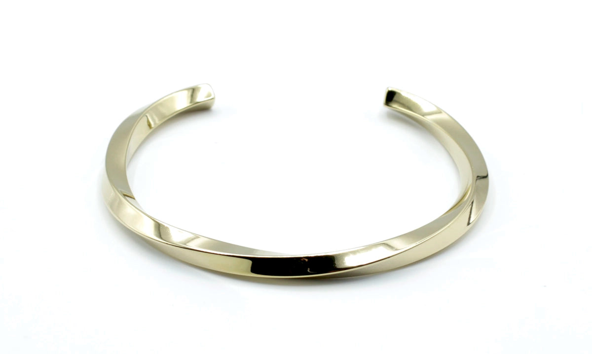 Brazalete Sweet Twist acero inoxidable dorado estructura abierta diseño en torsión muy vistosa - delacabra