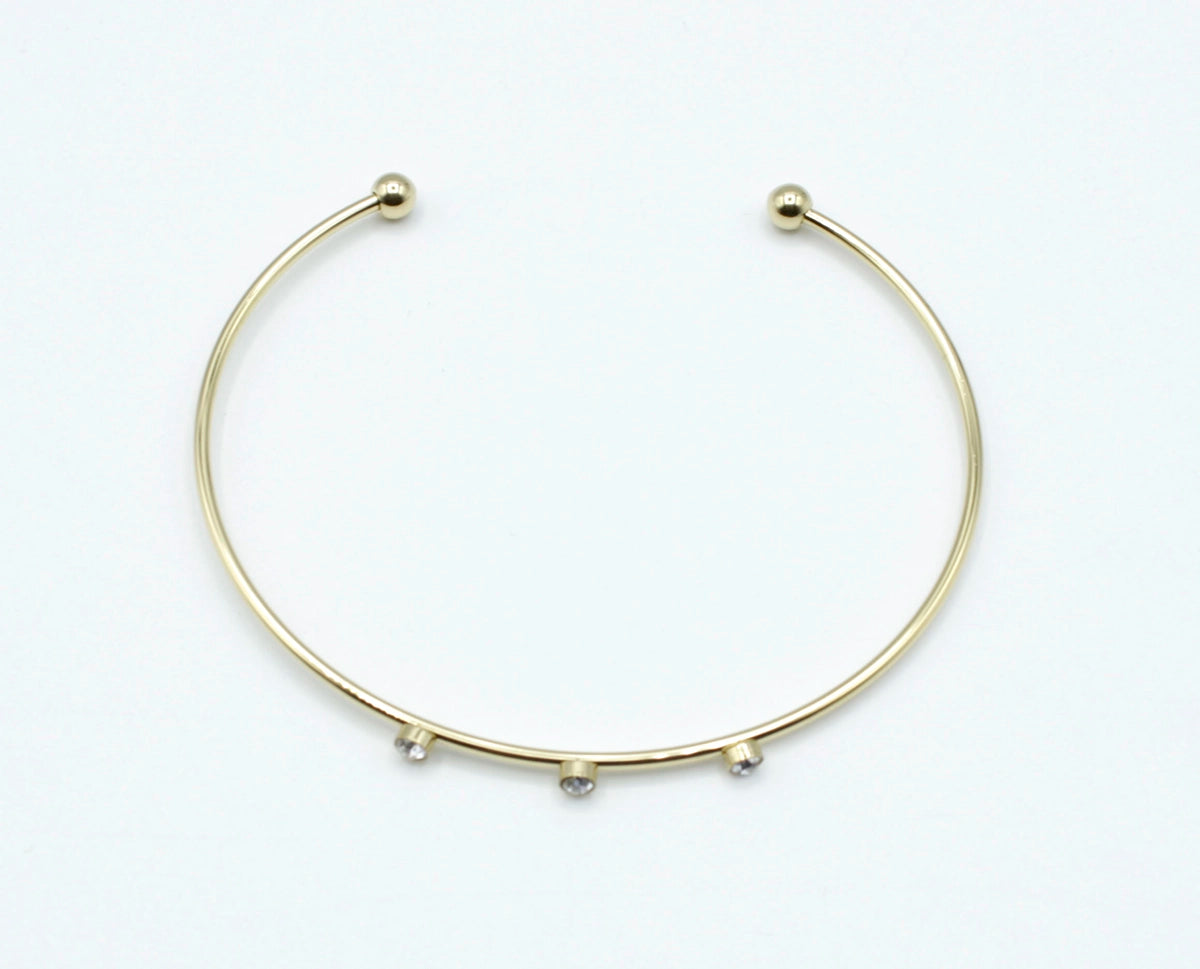 Brazalete Three Diamonds acero inoxidable dorado vista superior, extremos cuidadosamente acabados en dos bolas redondas perfectas - delacabra