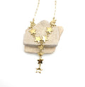 Collar Bella acero inoxidable dorado, estrellas doradas unidas apéndice de caída en cascada, moderno con carácter y versatilidad. DELACABRA.COM 