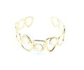 Brazalete Dolce acero inoxidable dorado ajustable diseño moderno y elegante con tres puntos de resina blanca - DELACABRA