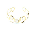 Brazalete Dolce acero inoxidable dorado ajustable diseño moderno y elegante con tres puntos de resina blanca - DELACABRA