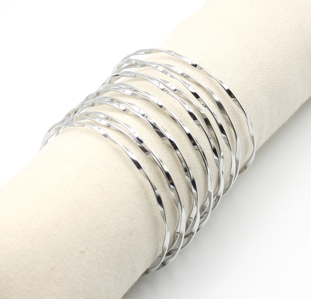 Brazalete Luz en acero inoxidable plateado con diseño ondulado y superficie pulida - DELACABRA