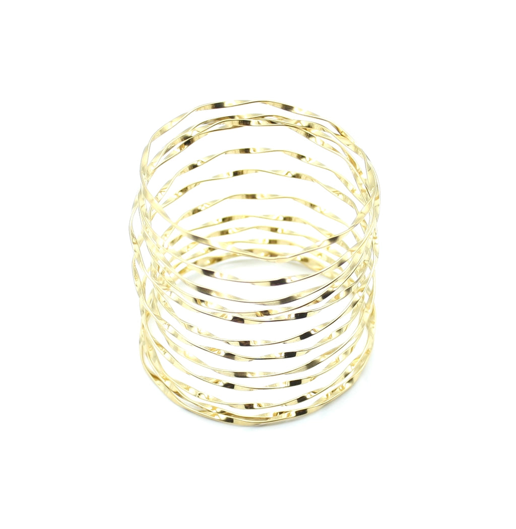 Brazalete Luz dorado con forma adaptable y líneas onduladas, acabado pulido - DELACABRA