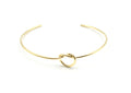 Brazalete Nude acero inoxidable dorado muy fino con un nudo marinero simple, acabado brillante, ligero y elegante - DELACABRA