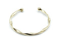 Brazalete Acqua dorado con extremos en forma de bola, acabado brillante y diseño helicoidal, acero inoxidable hipoalergénico, resistente al agua, ajustable y duradero -DELACABRA