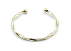 Brazalete Acqua dorado con extremos en forma de bola, acabado brillante y diseño helicoidal, acero inoxidable hipoalergénico, resistente al agua, ajustable y duradero -DELACABRA