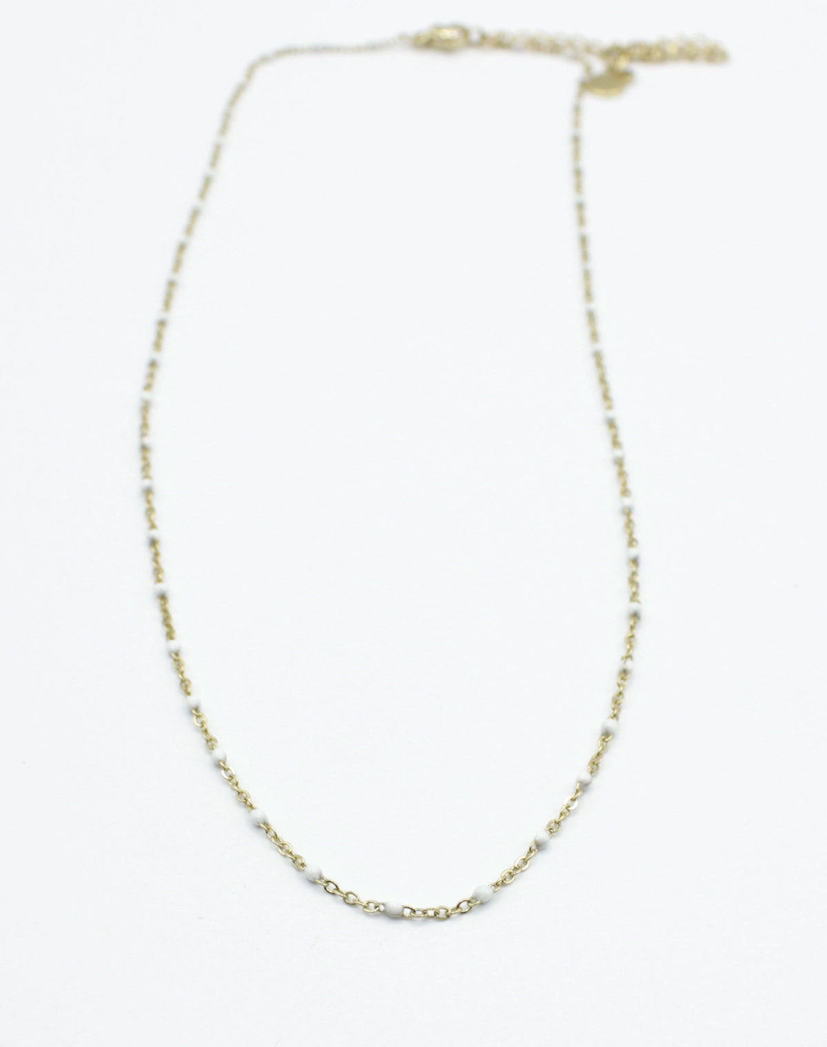 Collar Serena acero inoxidable dorado con puntos de resina blancos - delacabra