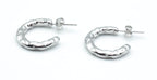 Pendientes Chunky plateados con forma gruesa y textura irregular, acero inoxidable hipoalergénico, resistente al agua y pensado para uso diario. DELACABRA