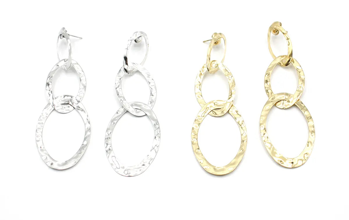 Pendientes Nicols acero inoxidable plateado y dorado, diseño moderno con textura martillada, acabado brillante, resistente al agua, elegante y versátil. DELACABRA SHOP