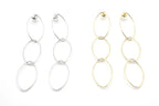 Pendientes largos de acero inoxidable, diseño de eslabones en dorado y plateado sobre fondo blanco.