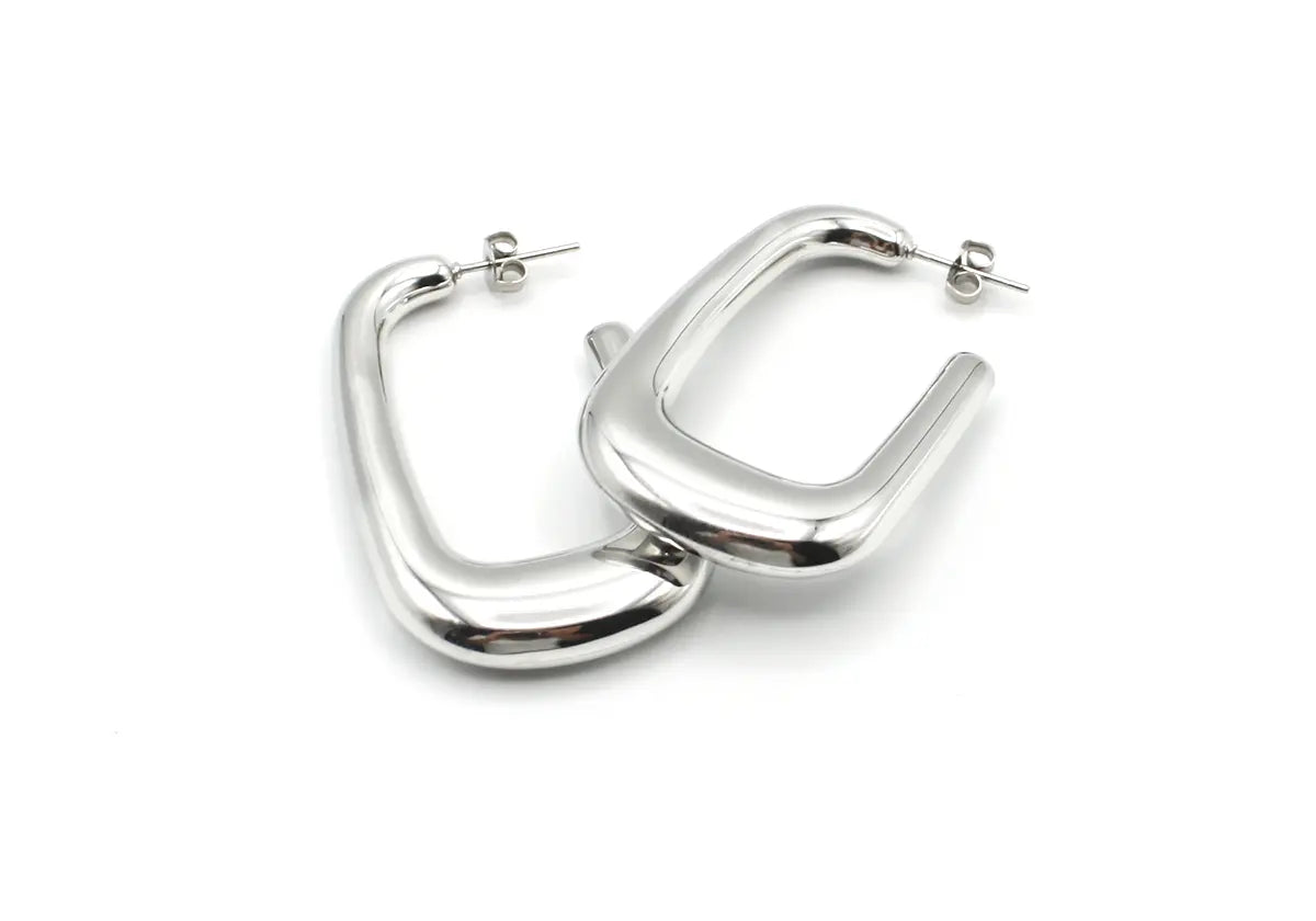Pendientes Sunlight plateados en acero inoxidable hipoalergénico, acabado brillante espejo, ligeros y elegantes -DELACABRA