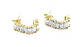 Aros Vogue dorados con detalle de piedras brillantes, elaborados en acero inoxidable hipoalergénico, resistente al agua y pensado para durar. Cierre de presión. DELACABRA